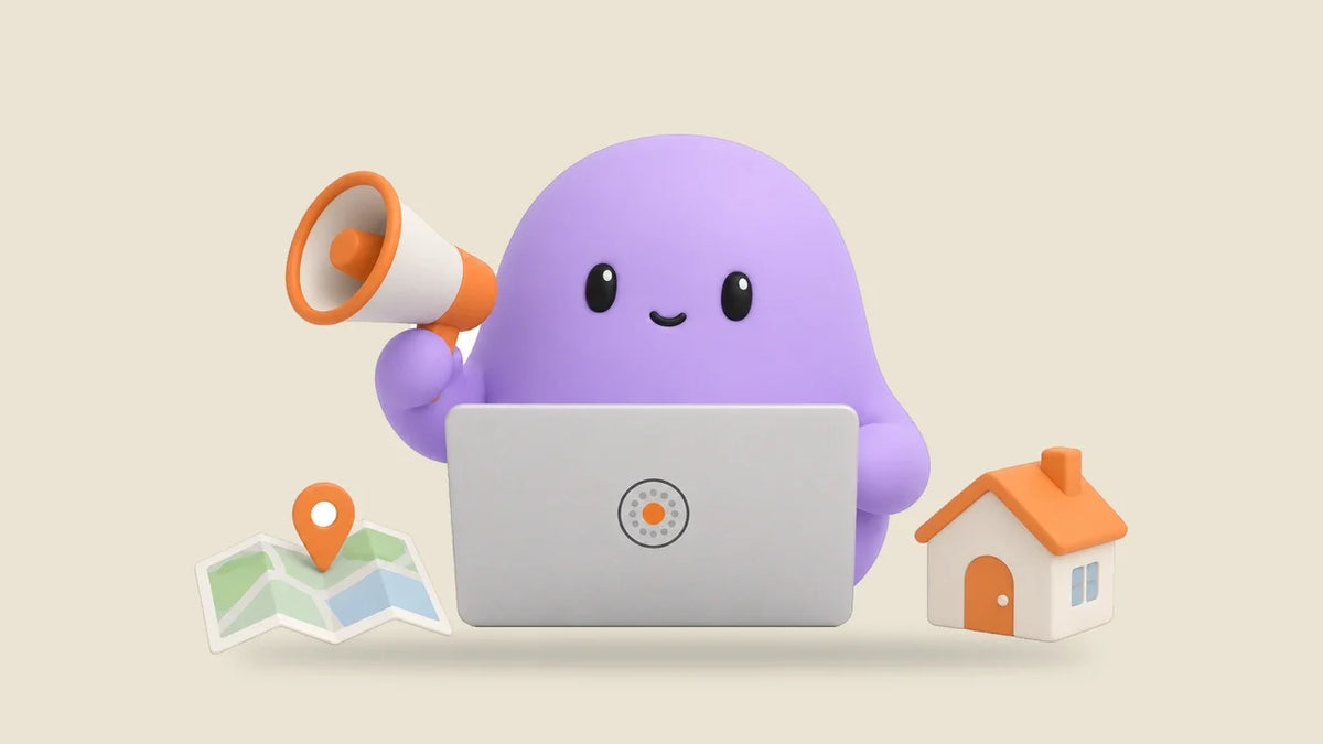 Reggie at a laptop beside a folded map with an orange pin and a toy house