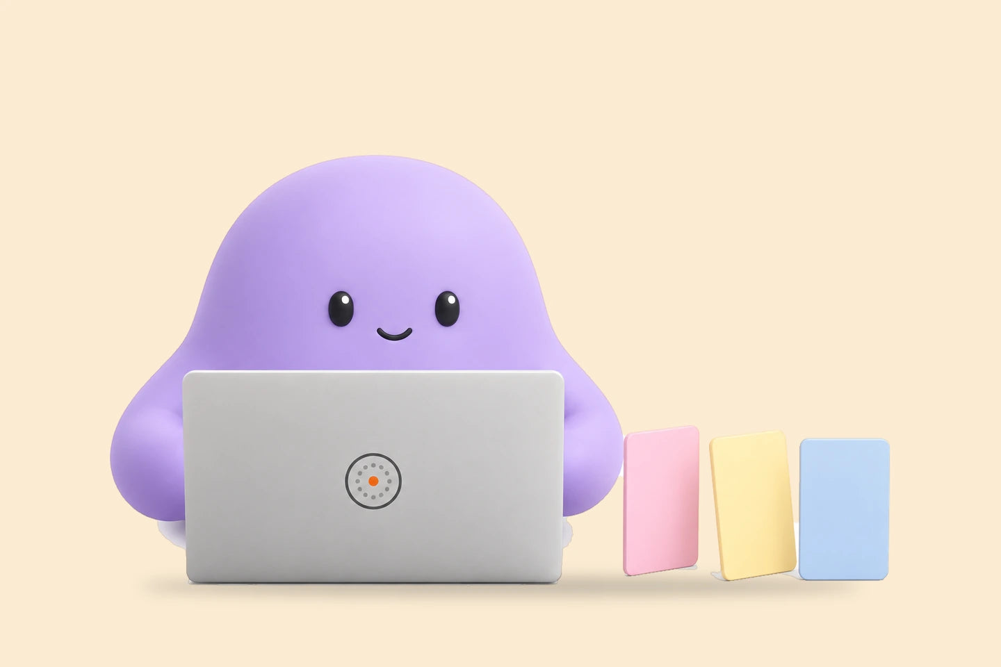 Reggie lines up three blank cards beside a laptop