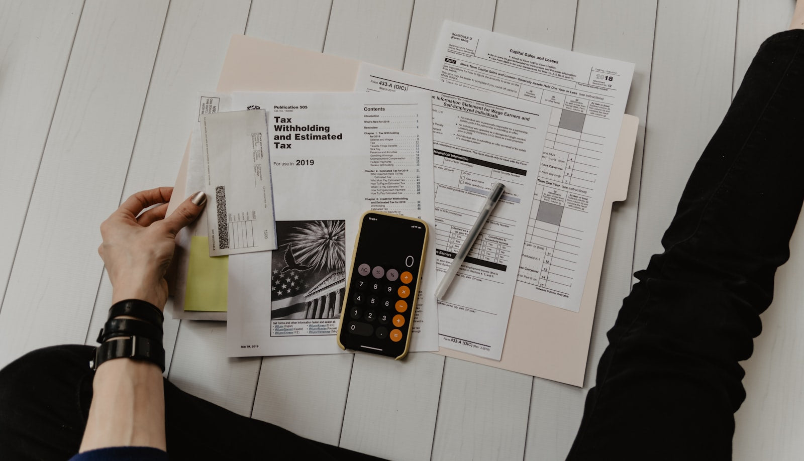 Business owner reviewing revenue figures at a desk