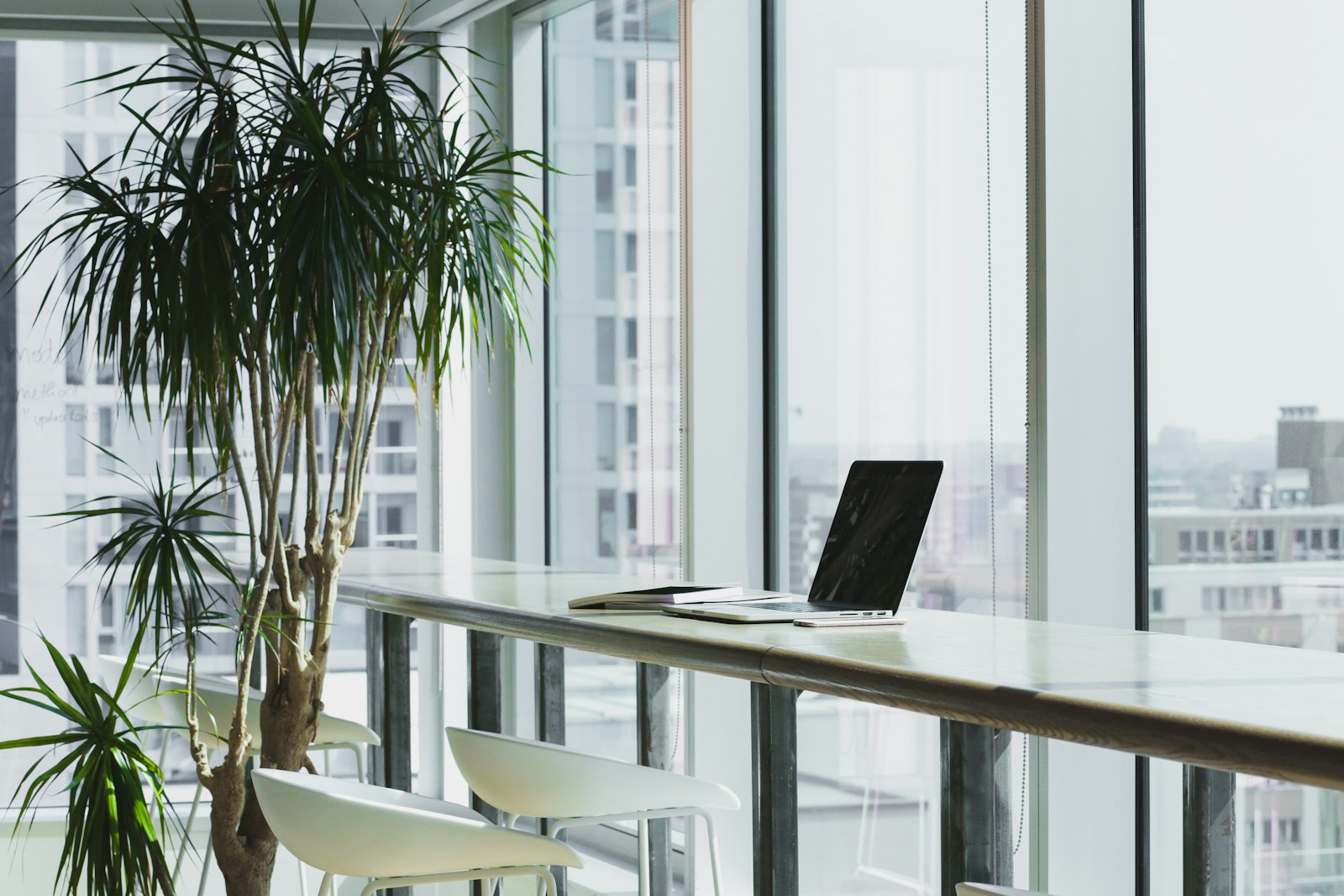 A bright open-plan office with a small team at work