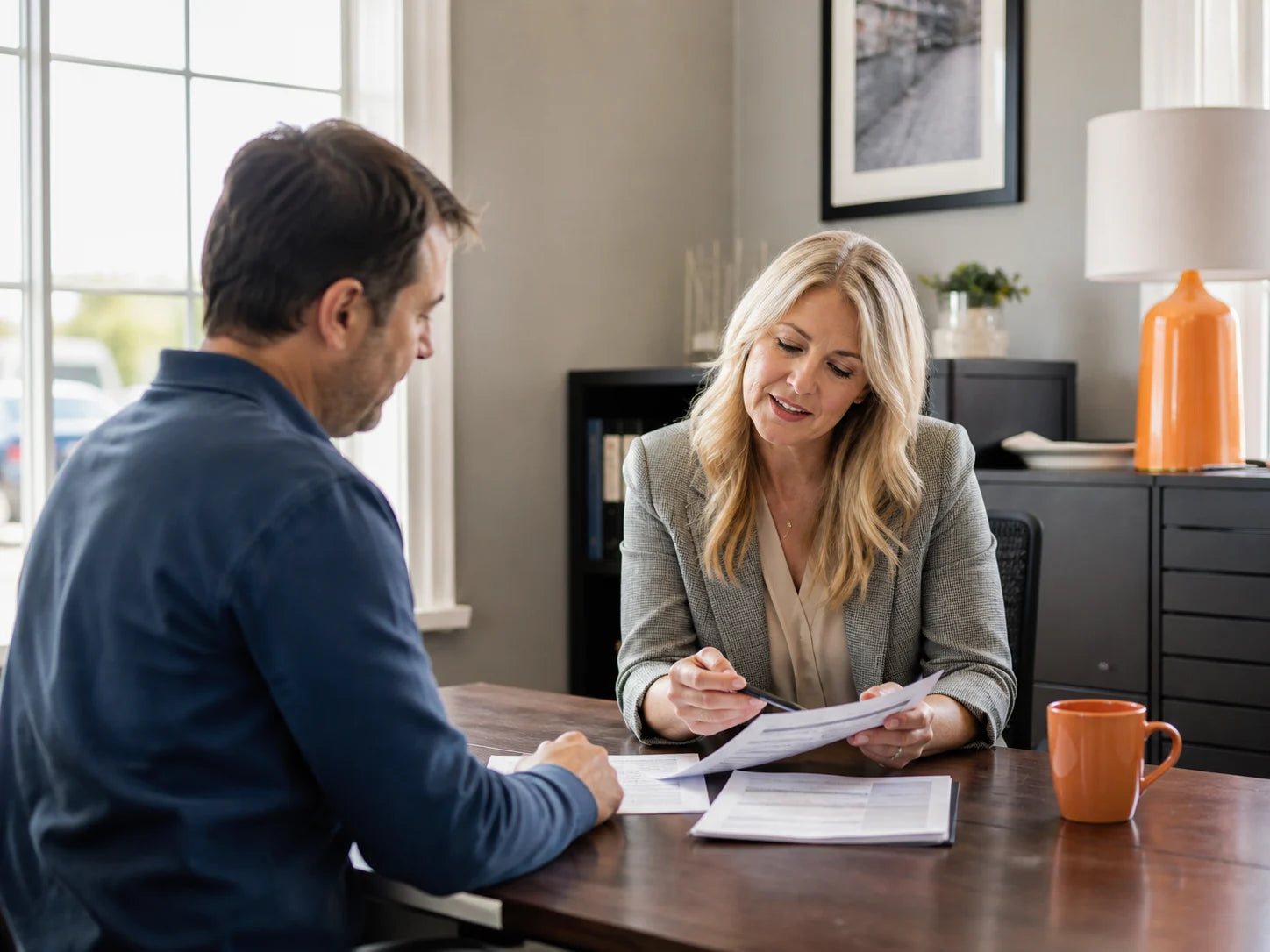 Independent insurance agent helping a business owner with a quote request