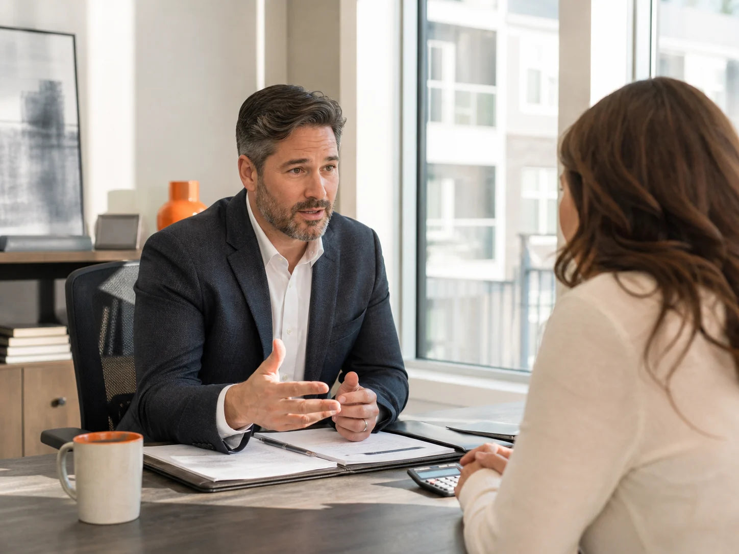 Mortgage broker helping a homebuyer organize a financing inquiry