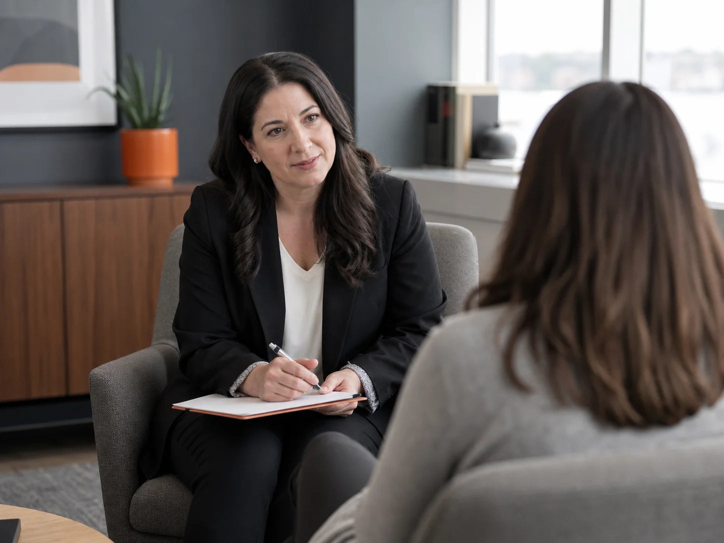 Family-law intake coordinator listening to a prospective client