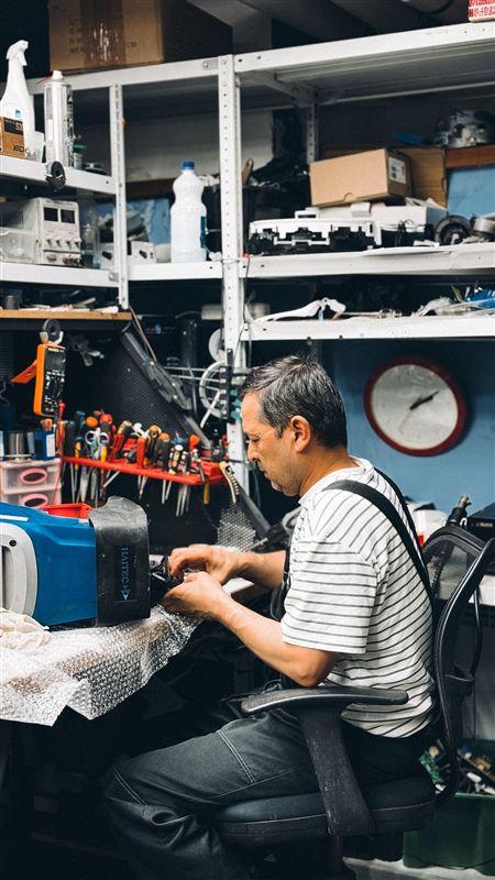 Locksmith working at a service counter